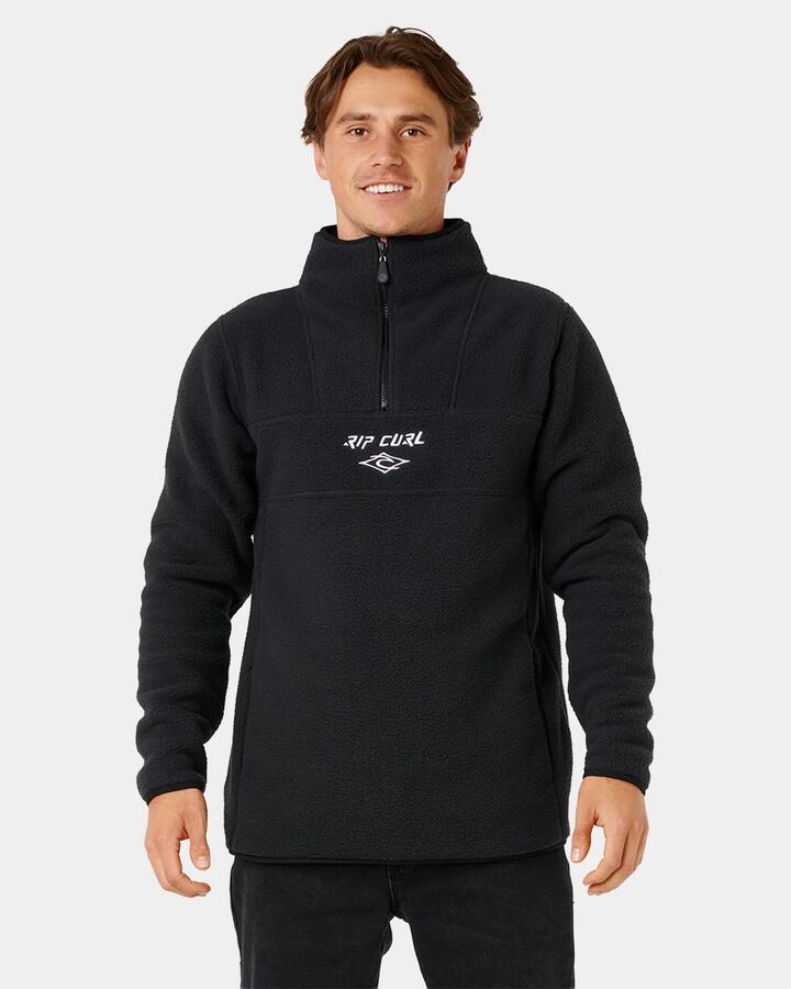 Image of a model wearing Outerwear. Product name - Rip Curl Mens Bells Polar Fleece Jumper Black in Black colour by brand - Rip Curl