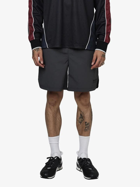 Image of a model wearing Shorts. Productname: Reebok Premier Running Club Woven Shorts in Almost Black colour by brand - Reebok