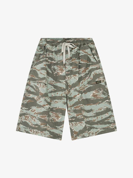 Image of a model wearing Shorts. Productname: Deus Unforseen Shorts in Ground Cover Green colour by brand - Deus