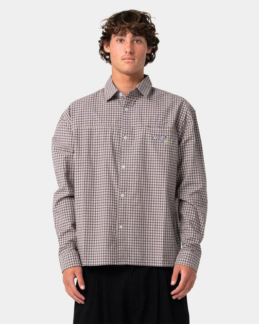 Image of a model wearing Tops. Product name - Rusty Mens Roadblock Long Sleeve Shirt Pinecone in Pinecone colour by brand - Rusty
