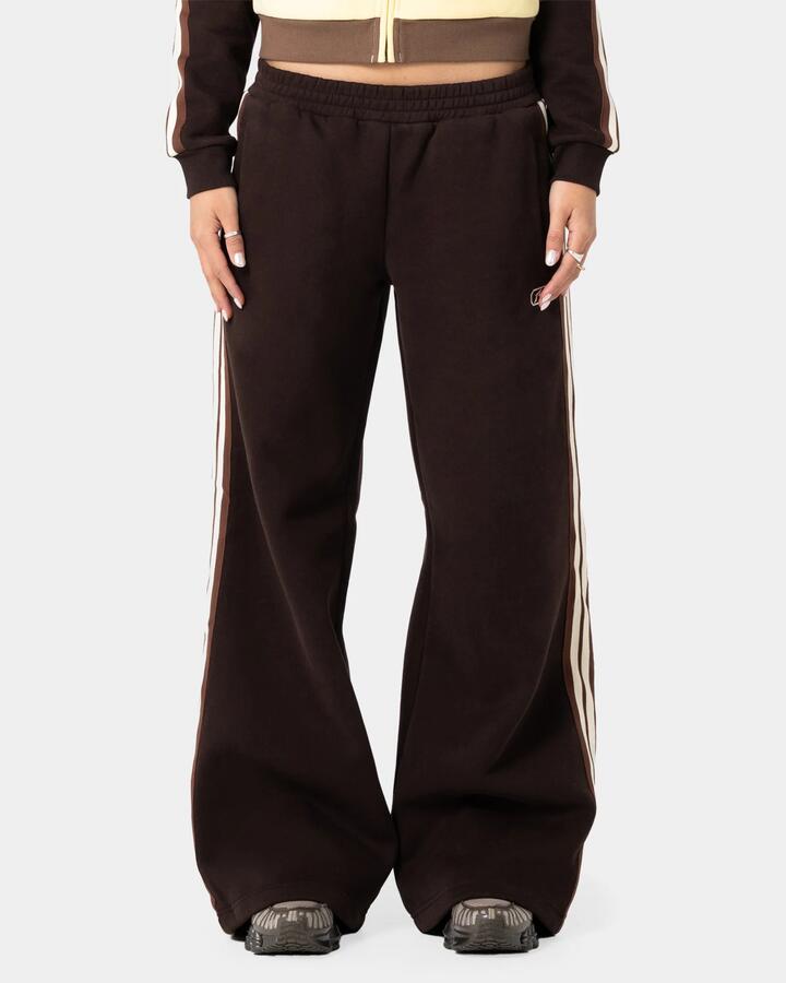 Image of a model wearing Pants. Product name - Rusty Womens Toffee Wide Leg Track Pants Java in Java colour by brand - Rusty