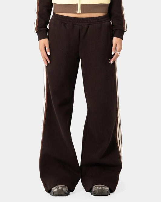 Image of a model wearing Pants. Product name - Rusty Womens Toffee Wide Leg Track Pants Java in Java colour by brand - Rusty