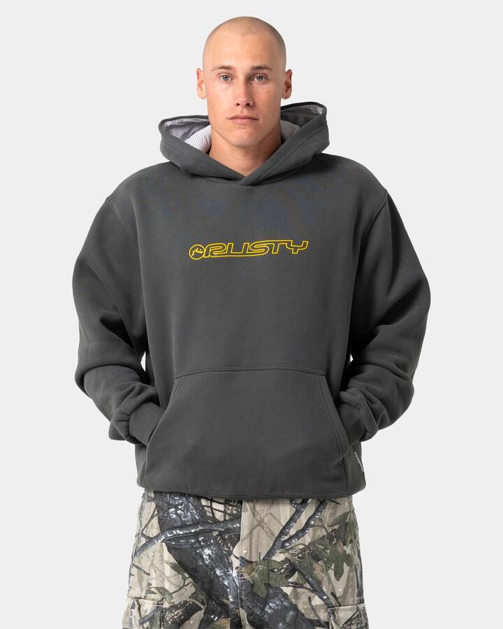 Image of a model wearing Outerwear. Product name - Rusty Mens Outliner Pullover Hoodie Carbon in Carbon colour by brand - Rusty