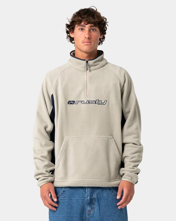 Image of a model wearing Outerwear. Product name - Rusty Mens Blizzard Quarter Zip Polar Fleece Jumper Abbey Stone in Abbey Stone colour by brand - Rusty