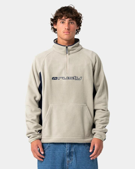 Image of a model wearing Outerwear. Product name - Rusty Mens Blizzard Quarter Zip Polar Fleece Jumper Abbey Stone in Abbey Stone colour by brand - Rusty