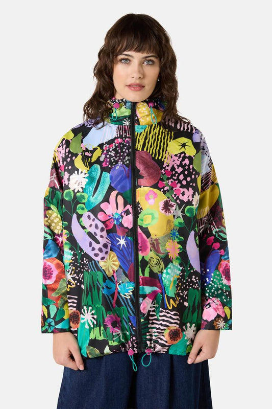 Image of a model wearing Rain Coats. Product name - Electric Eden Raincoat in Print colour by brand - Gorman