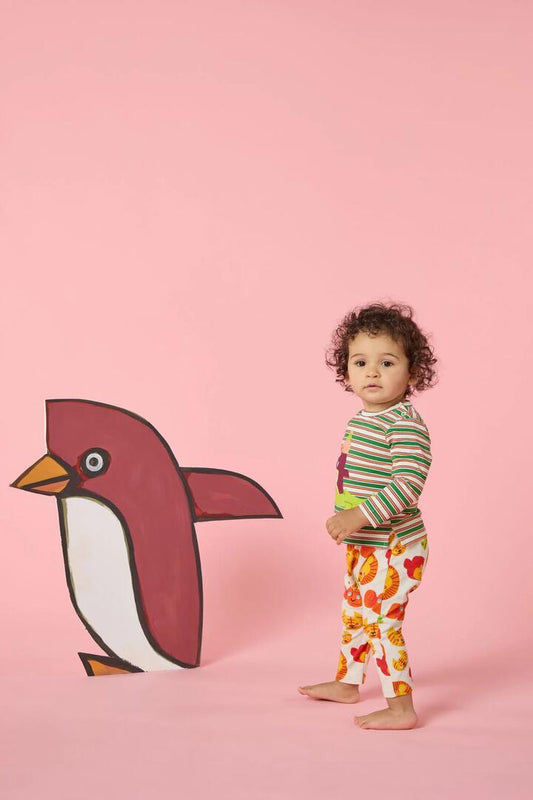 Image of a model wearing Pants. Product name - Animal Heads Baby Legging in Multi colour by brand - Gorman