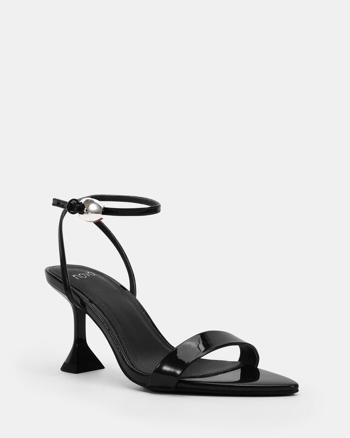 Image of Heels. Product name - Zibit Black Patent Vegan Heels in Black colour by brand - Novo