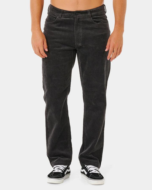 Image of a model wearing Pants. Product name - Rip Curl Mens Premium Surf Cord Pants Black in Black colour by brand - Rip Curl