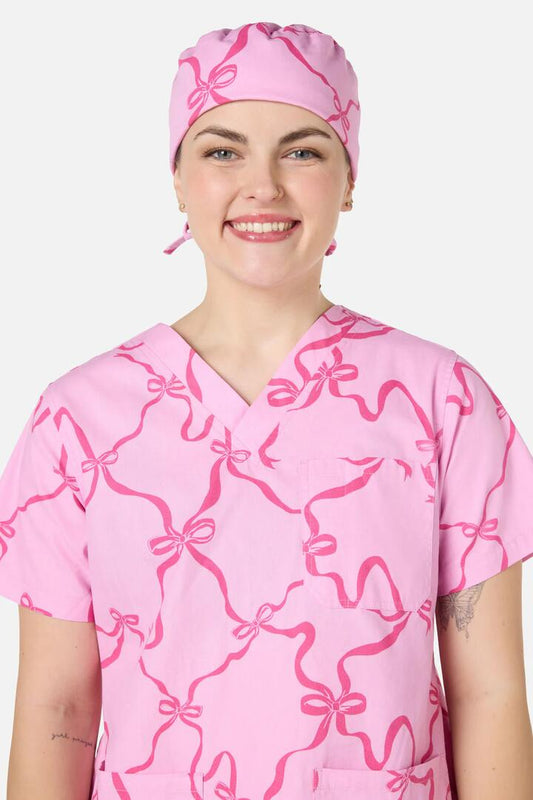 Image of Hats. Productname: Pink Bows Scrub Hat in Pink colour by brand - Scrubs With Love