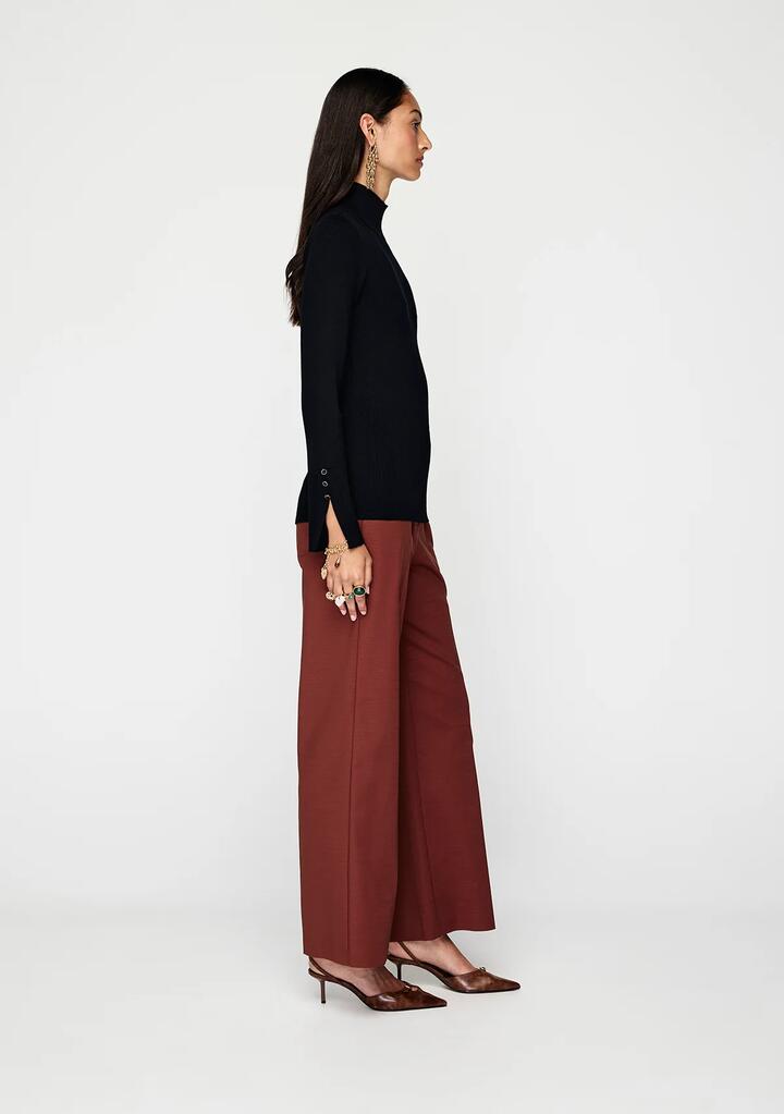 Image of a model wearing Tops. Productname: Vela Knit Top | MOS The Label in Black colour by brand - MOS The Label