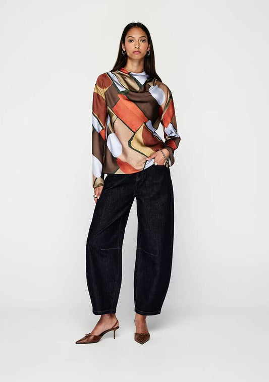 Image of a model wearing Tops. Productname: Koa Top | MOS The Label in Koa Print colour by brand - MOS The Label