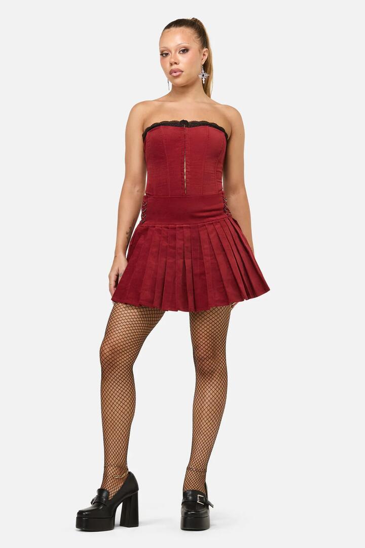 Image of a model wearing Skirts. Productname: Mabel Velvet Skort in Red colour by brand - Dangerfield