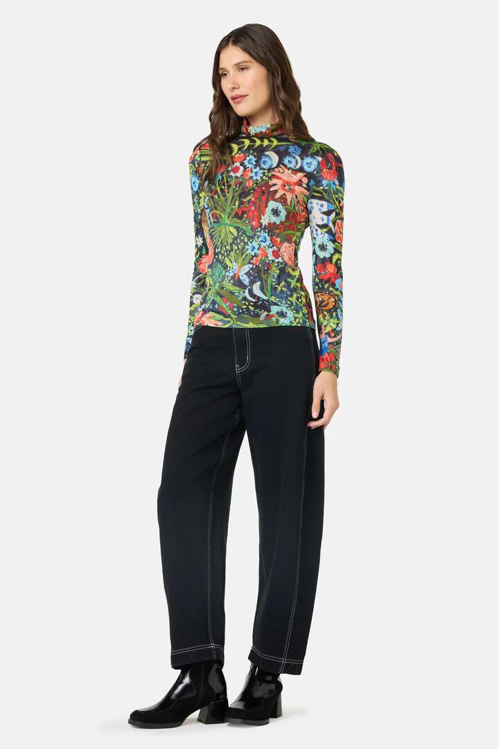 Image of a model wearing Tops. Product name - The Garden Merino Polo in Print colour by brand - Gorman