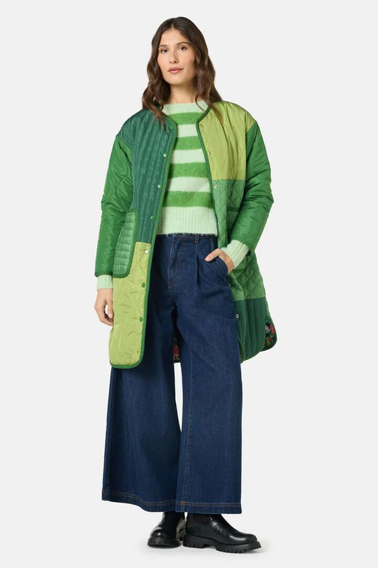 Image of a model wearing Outerwear. Product name - The Garden Reversible Coat in Print colour by brand - Gorman