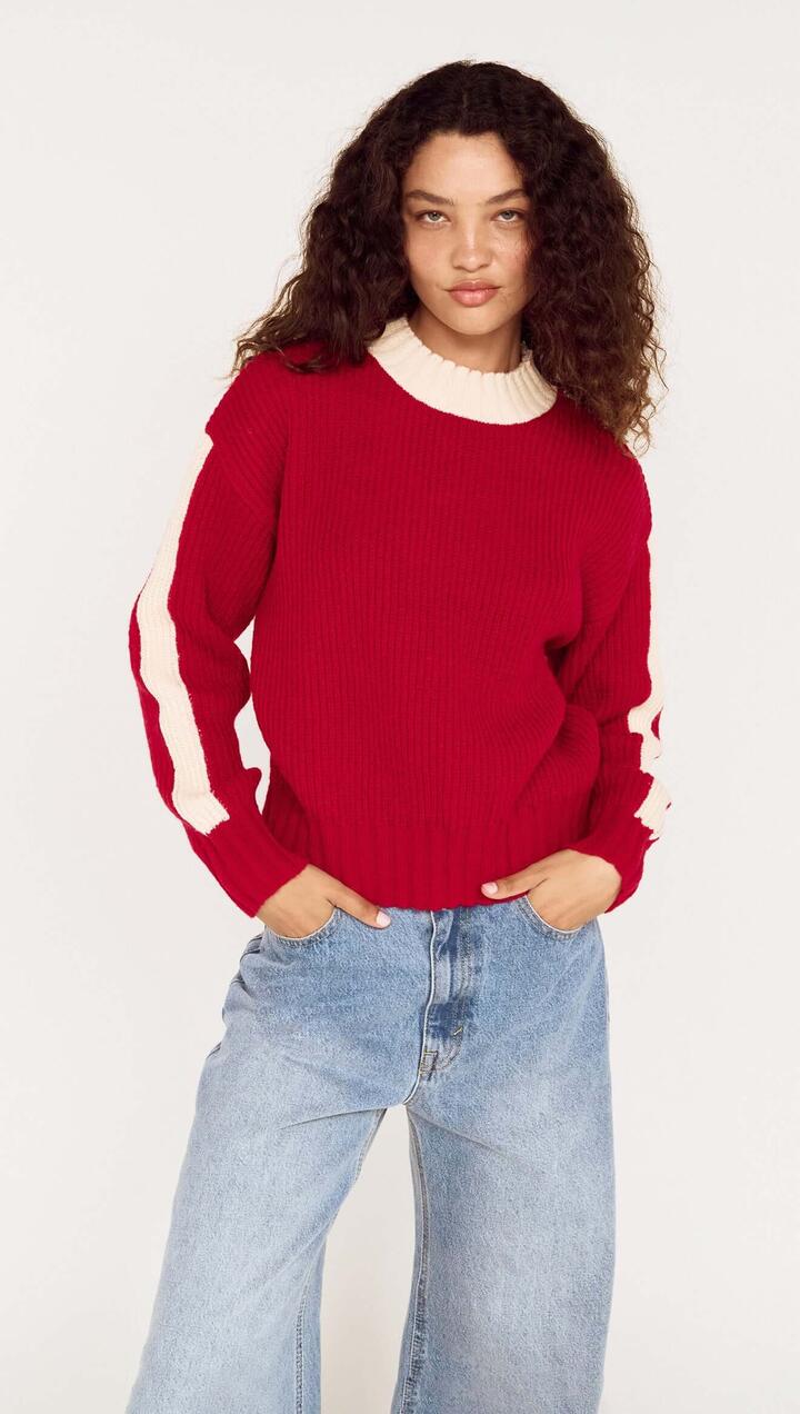 Image of a model wearing Outerwear. Product name - Relaxed Red Contrast Stripe Jumper in Wine/Cream colour by brand - MINKPINK