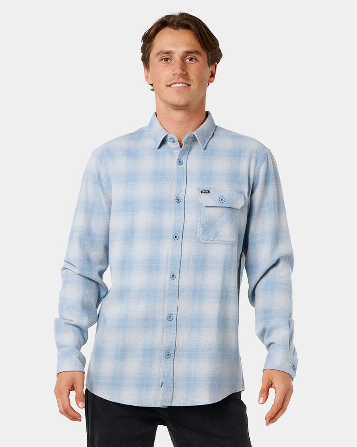 Image of a model wearing Tops. Product name - Rip Curl Mens Grinners Flannel Long Sleeve Shirt Faded Denim in Faded Denim colour by brand - Rip Curl