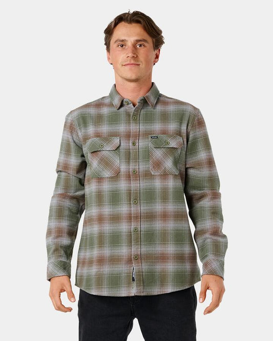 Image of a model wearing Tops. Product name - Rip Curl Mens Count Flannel Long Sleeve Shirt Dark Olive in Dark Olive colour by brand - Rip Curl