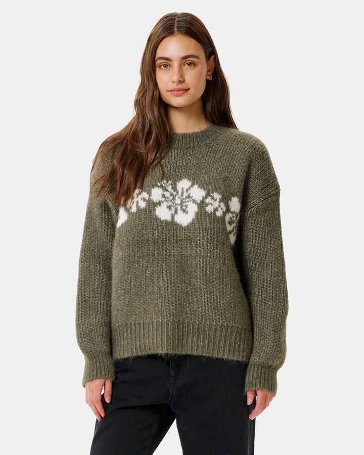 Image of a model wearing Tops. Product name - Rip Curl Womens Cala Nights Hibiscus Knit Crew Neck Moss in Moss colour by brand - Rip Curl