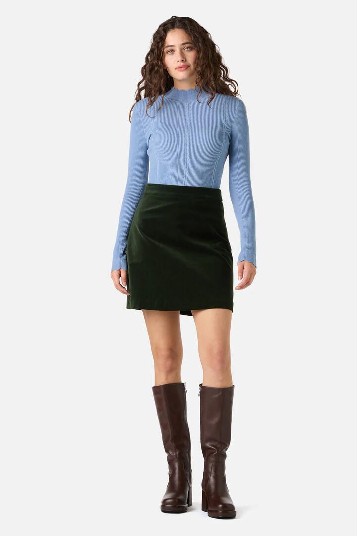 Image of a model wearing Skirts. Productname: Rachel Velvet Skirt in Olive Green colour by brand - Princess Highway