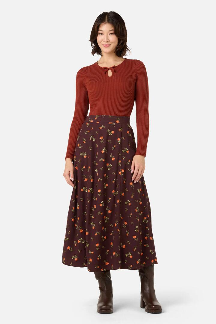 Image of a model wearing Skirts. Productname: Evie Rose Midi Skirt in Burgundy colour by brand - Princess Highway