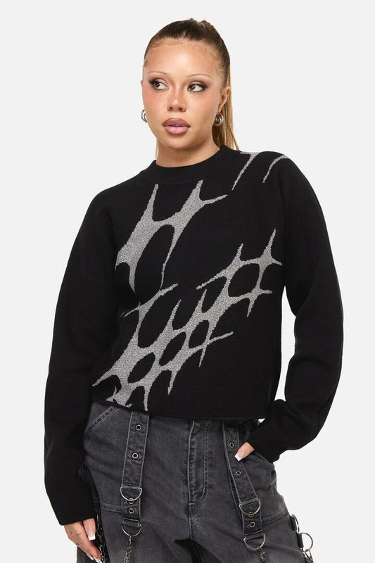 Image of a model wearing Outerwear. Productname: Y2K Sigil High Neck Jumper in Black colour by brand - Dangerfield