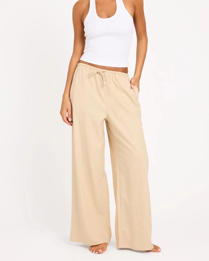 Image of a model wearing Pants. Product name - Roxy Womens Lolani Linen Pants Pebble in Pebble colour by brand - Roxy
