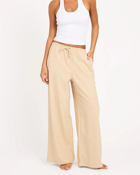 Image of a model wearing Pants. Product name - Roxy Womens Lolani Linen Pants Pebble in Pebble colour by brand - Roxy