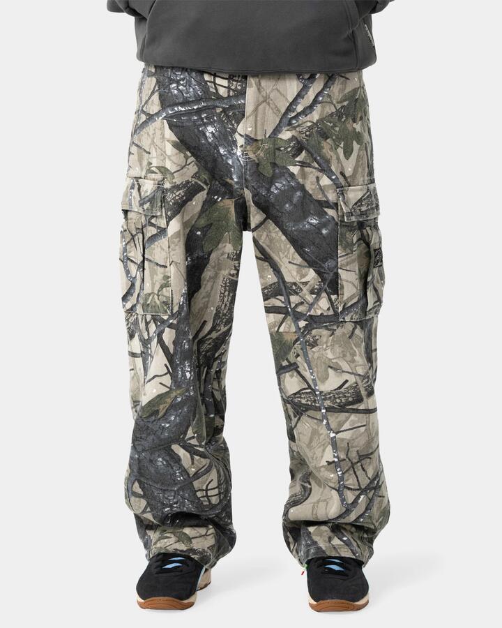 Image of a model wearing Pants. Product name - Rusty Mens Commando Cargo Pants Grey Camo in Grey Camo colour by brand - Rusty