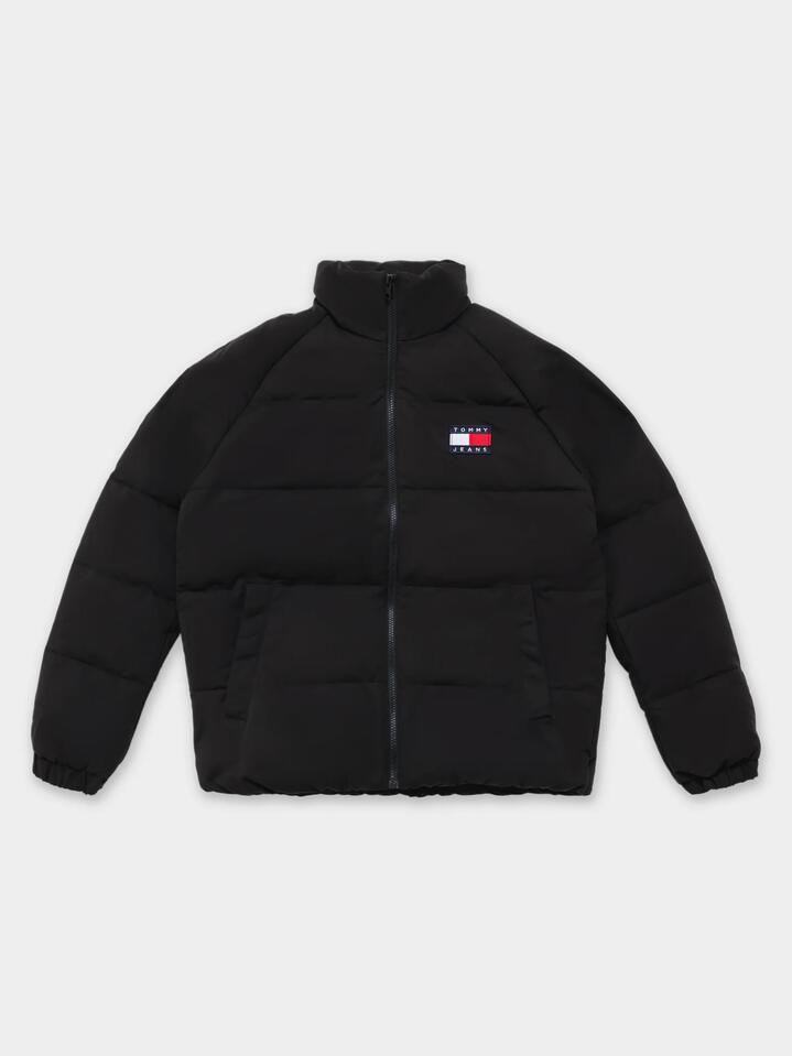 Image of a model wearing Outerwear. Productname: Tommy Hilfiger Tommy Graphic Puffer Jacket in Black colour by brand - Tommy Hilfiger