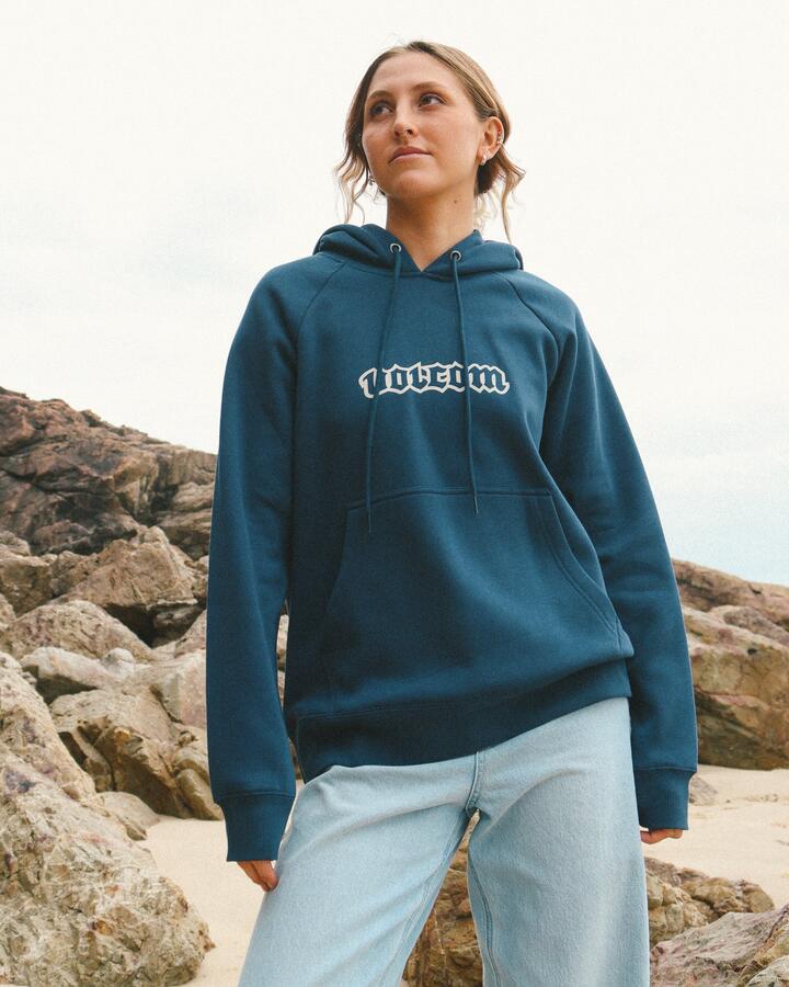 Image of a model wearing Outerwear. Product name - Volcom Womens Get More Pullover Hoodie Baja Indigo in Baja Indigo colour by brand - Volcom