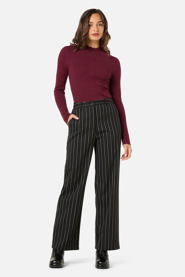Image of a model wearing Pants. Productname: Celeste Pinstripe Pant in Black colour by brand - Princess Highway