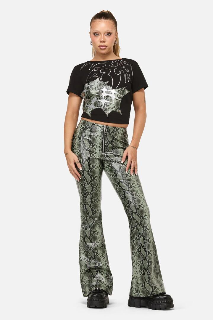 Image of a model wearing Pants. Productname: Y2K Snakey Fitted PU Flare Pant in Grey colour by brand - Dangerfield