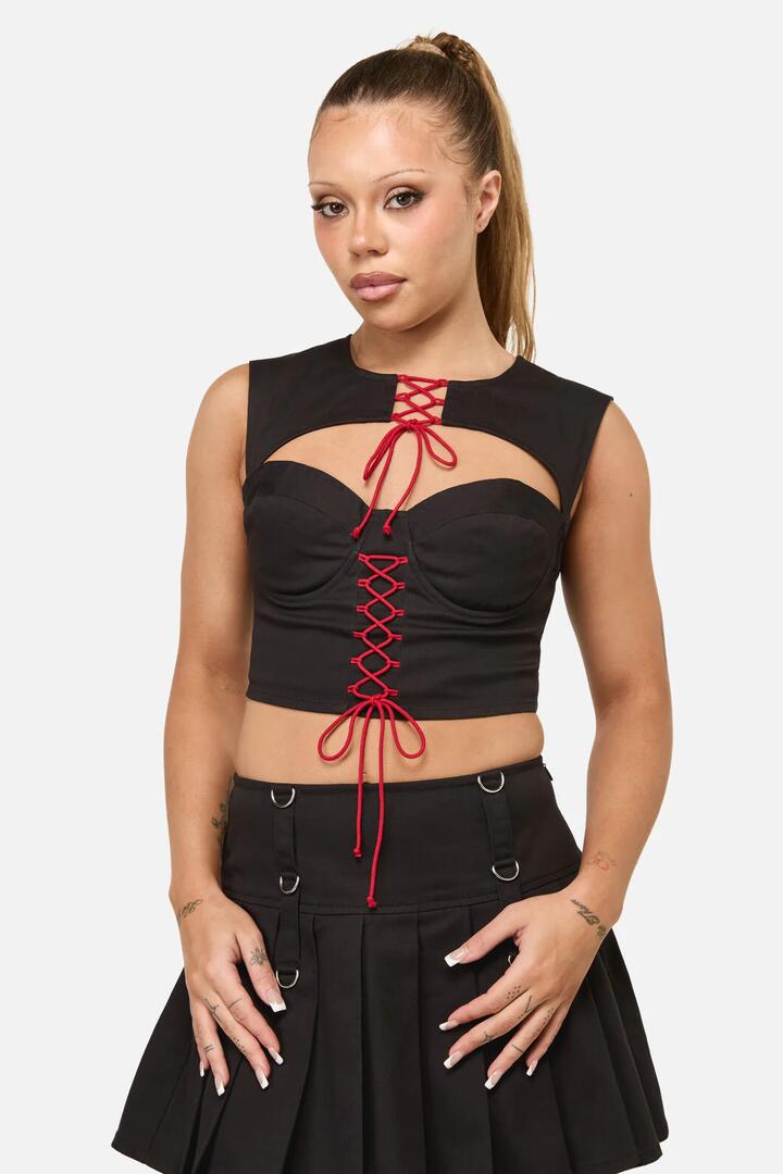 Image of a model wearing Tops. Productname: Crowned Lace Up Corset Top in Black colour by brand - Dangerfield