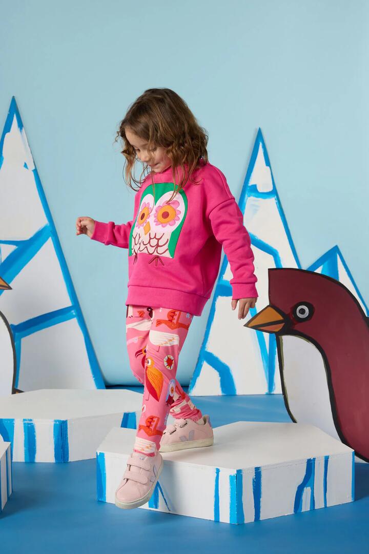 Image of a model wearing Pants. Product name - Funky Birds Kids Legging in Pink colour by brand - Gorman
