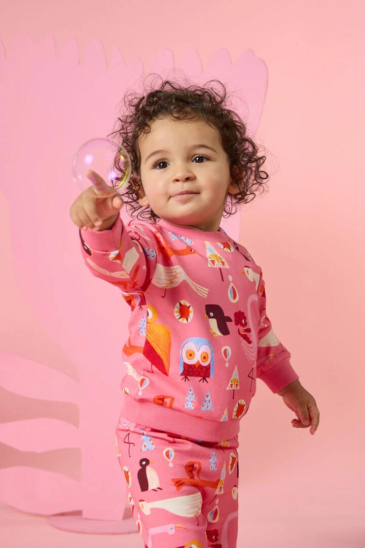 Image of a model wearing Outerwear. Product name - Funky Birds Baby Sweater in Pink colour by brand - Gorman