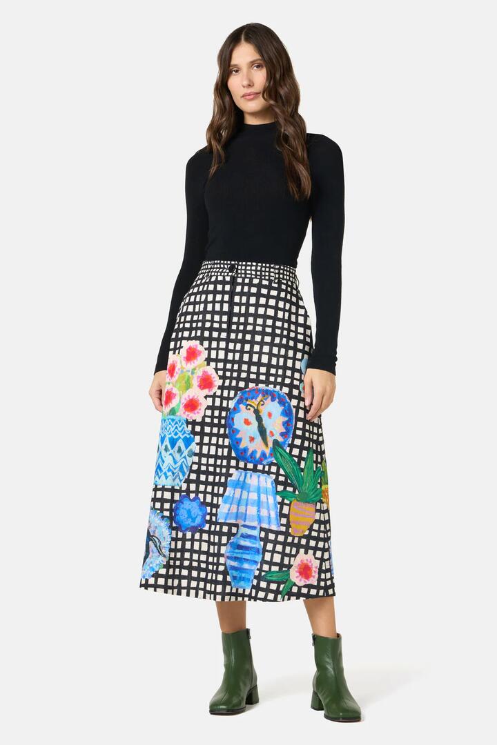 Image of a model wearing Skirts. Product name - Garden Table Midi Skirt in Print colour by brand - Gorman