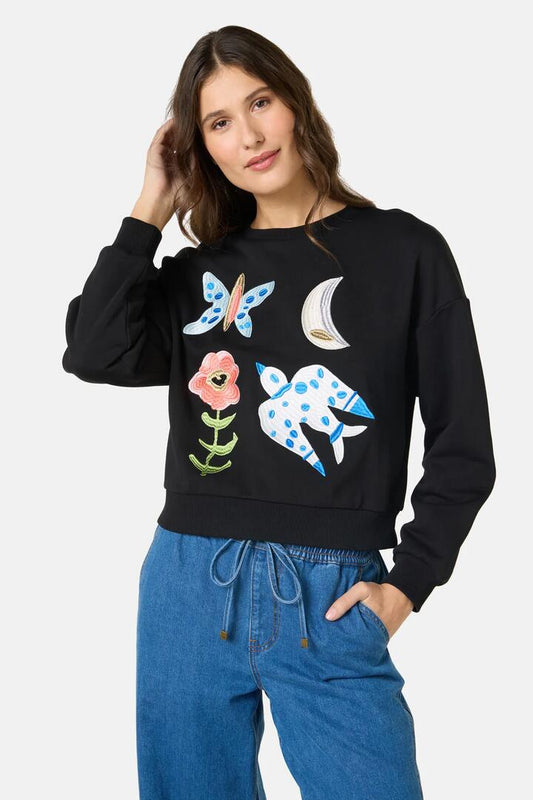 Image of a model wearing Outerwear. Product name - The Garden Embroidered Sweater in Black colour by brand - Gorman