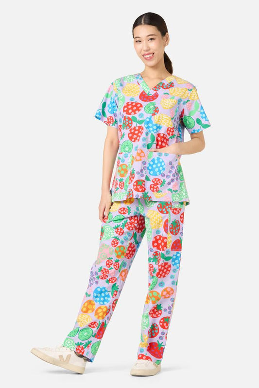 Image of a model wearing Uniforms & Workwear. Product name - Fruity Folk Scrub Set in Lilac colour by brand - Gorman