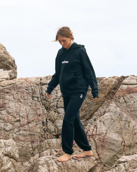 Image of a model wearing Pants. Product name - Volcom Womens Get More Trackpants Black in Black colour by brand - Volcom