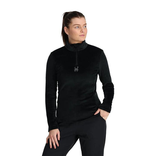 Image of a model wearing Outerwear. Product name - Spyder Womens Shimmer Bug 1/2 Zip Jumper Black in Black colour by brand - Spyder