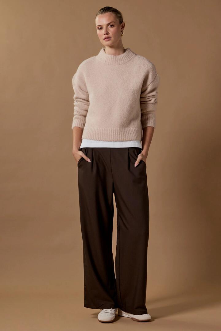 Image of a model wearing Pants. Product name - Instinctive Dark Chocolate Wide Leg Elastic Back Pants in Dark Chocolate colour by brand - Among the Brave