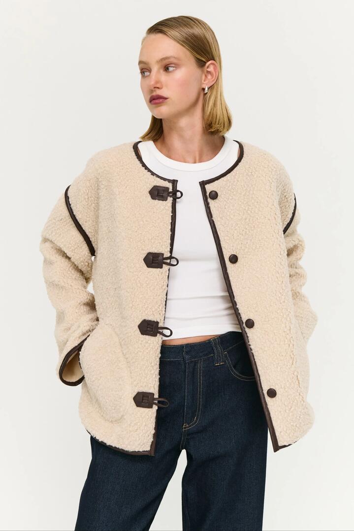 Image of Coats & Jackets. Product name - Pascal Beige Teddy Chocolate Trim Duffle Coat in Beige colour by brand - Staple The Label
