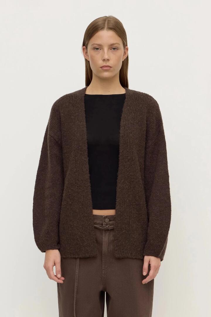 Image of a model wearing Outerwear. Product name - Ariel Dark Choc Wool Blend Cardigan in Brown colour by brand - Assembly Label