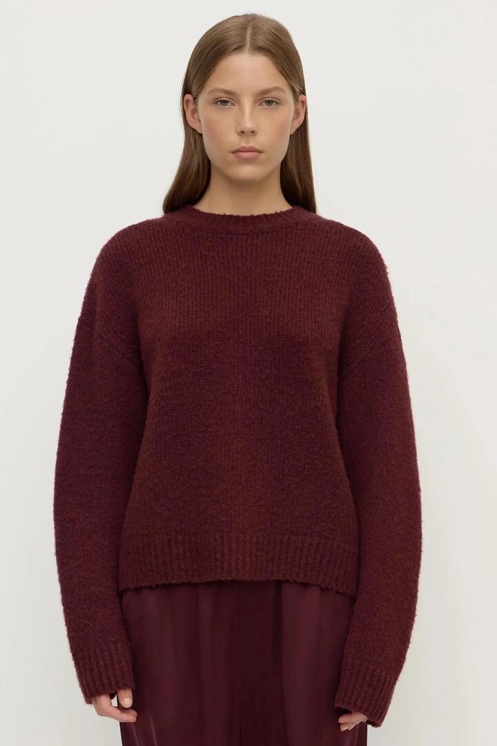 Image of a model wearing Outerwear. Product name - Ariel Merlot Alpaca Blend Knit in Red colour by brand - Assembly Label