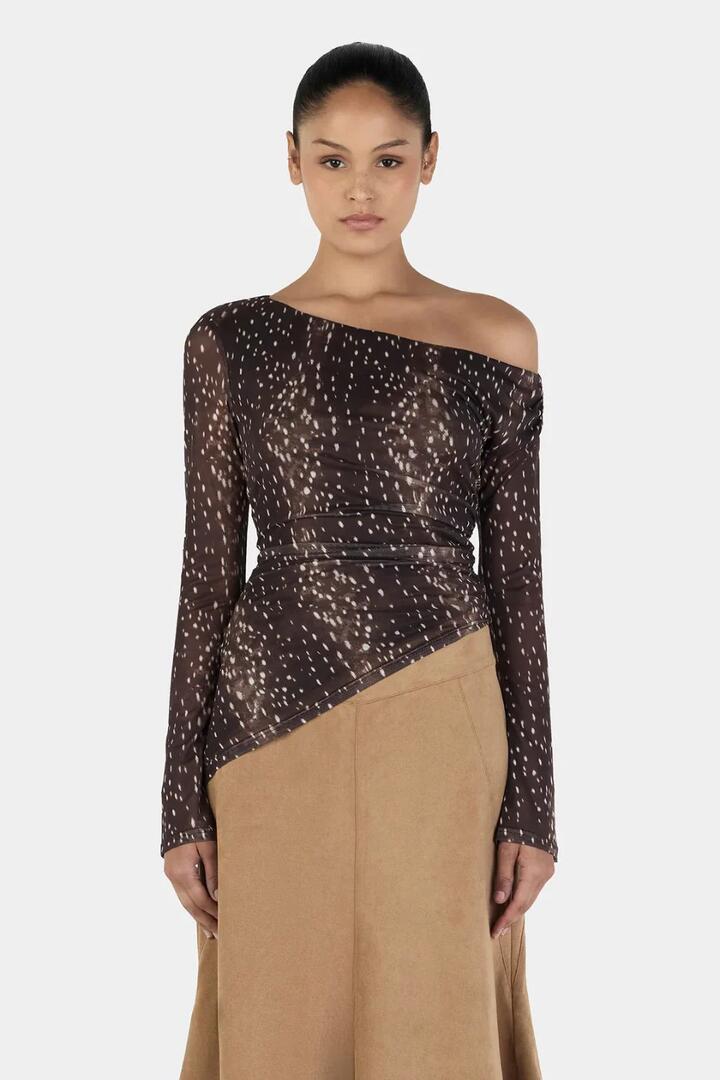 Image of a model wearing Tops. Product name - Paige Bambi Brown Asym Hem LS Top in Brown colour by brand - Ownley