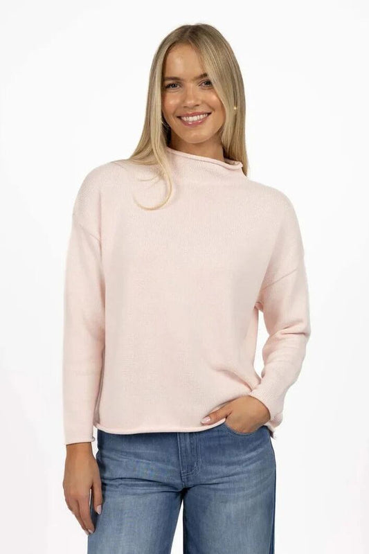 Image of a model wearing Outerwear. Product name - Divine Pink Roll Neck Cotton Jumper in Pink colour by brand - Humidity Lifestyle