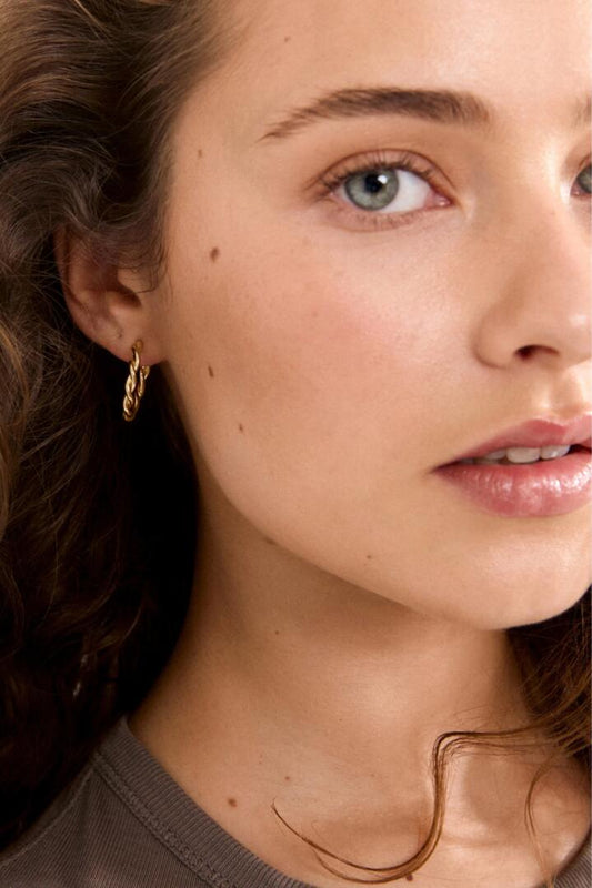 Image of Jewelry. Product name - Naja Pi Gold Twisted Small Hoop Earrings in Gold colour by brand - Pilgrim