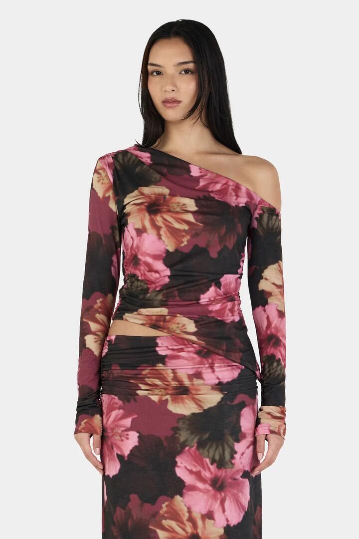Image of a model wearing Tops. Product name - Pearla Winter Hibiscus Print Asym Neck LS Top in Multi colour by brand - Ownley