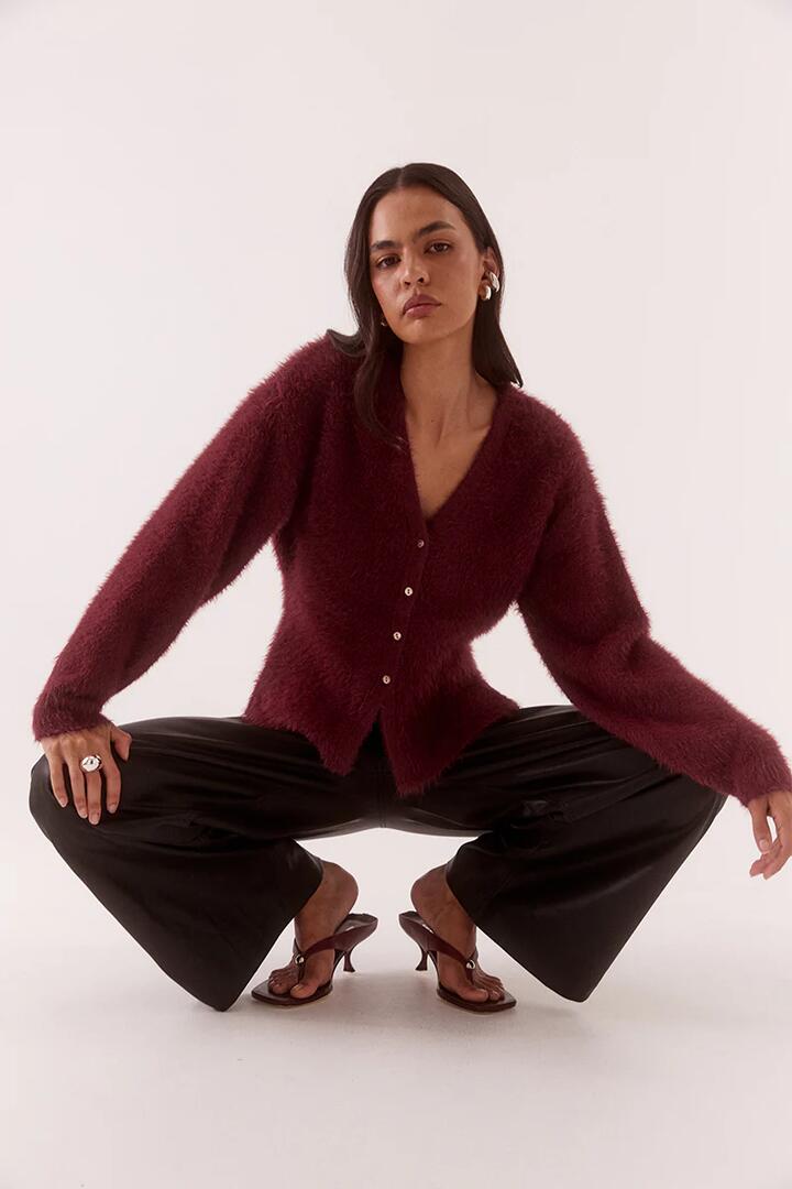 Image of a model wearing Outerwear. Product name - Arcade Vino Red Fluffy Cardi in Red colour by brand - Sovere